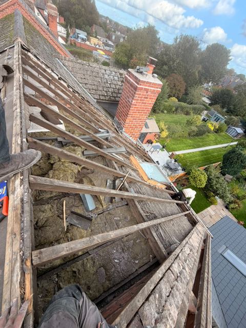Old roof stripped back to the rafters with insulation exposed, Kidderminster